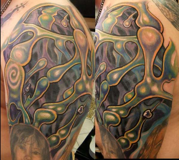 cover up of texas longhorn with water molecules by Beto Munoz of tattoo