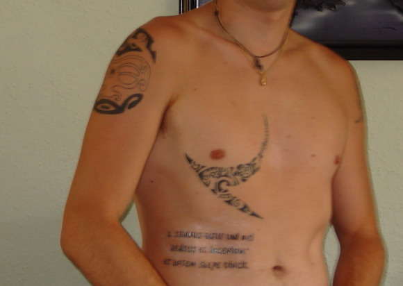 Maori + Latin text tattoo