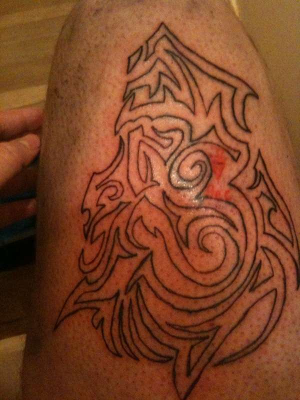 tribal demon head tattoo