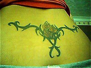tribal with 3 roses tattoo