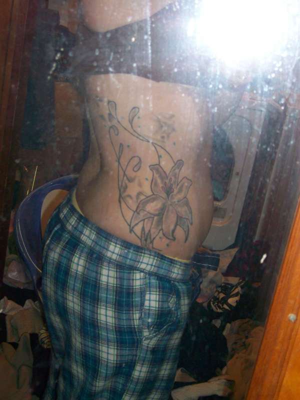 lily and stars tattoo