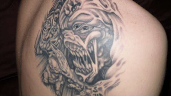 monster getting baby tattoo