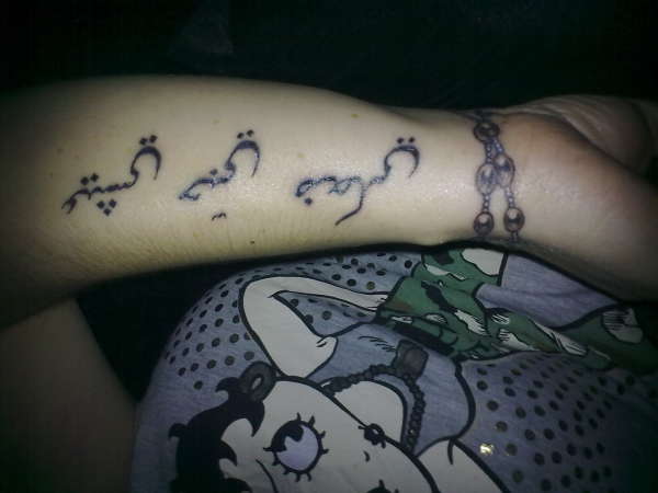 rosary beads and symbol tattoo