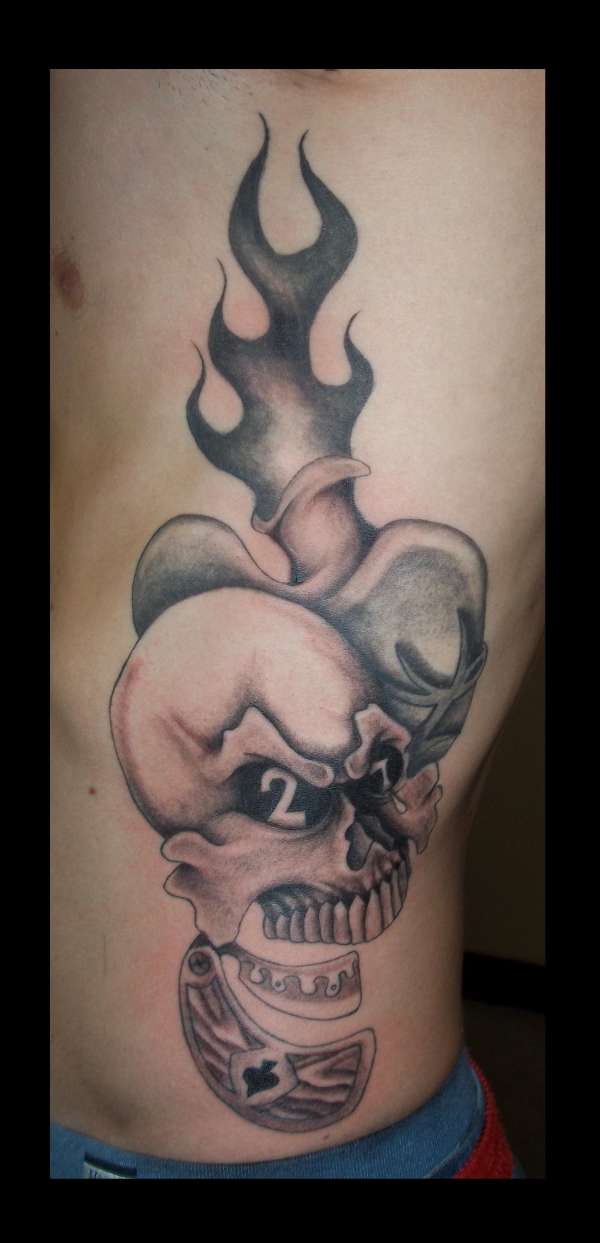 skull with straight razor jaw and sacred heart tattoo
