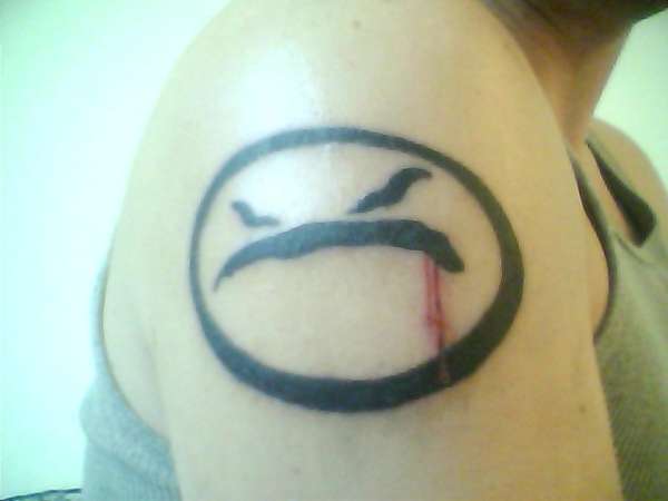 MAD face tattoo