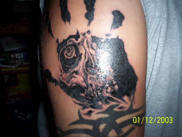 Scull hand tattoo