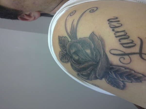 Black Rose with my nieces name tattoo
