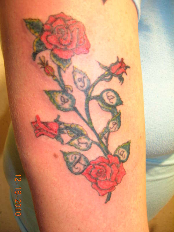 Branch Of Roses With Daughter's Name tattoo
