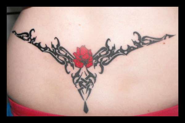 My lower back rose piece close up tattoo