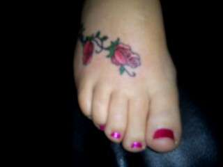 Rose on foot tattoo