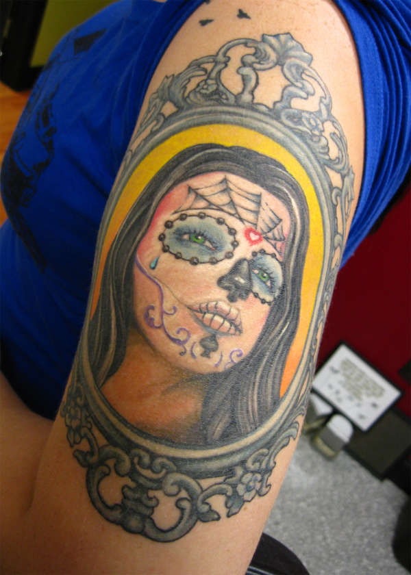 Skull face girl tattoo