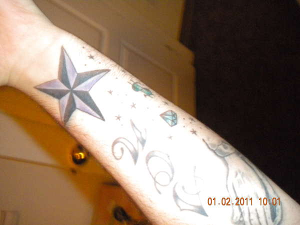 Star and dust tattoo