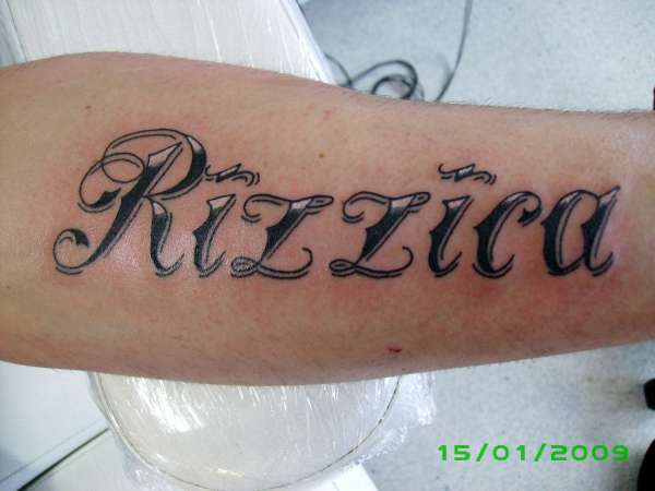 greywash writing script mens arm tattoo