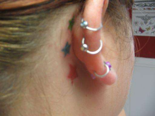 stars behind my ear tattoo