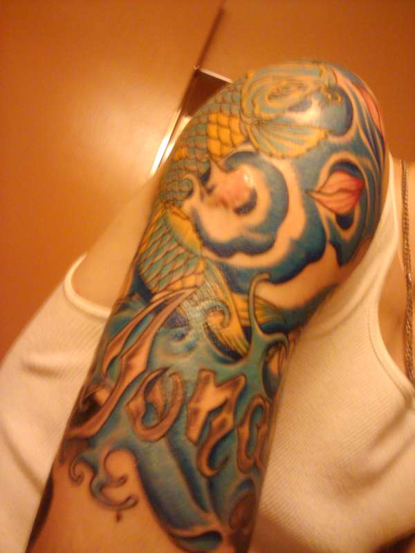 Koi Fish my sons name and a lotus tattoo