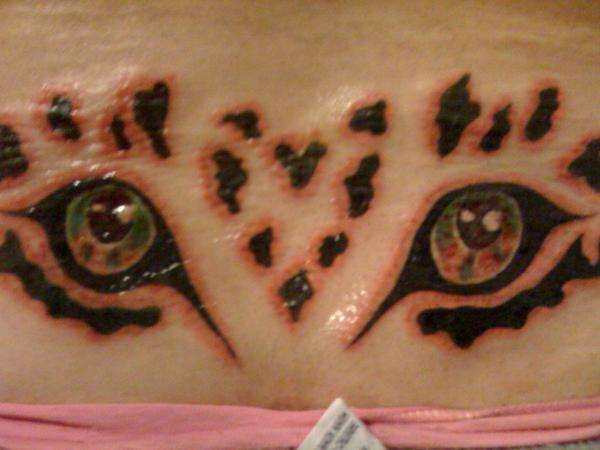 Leopards eyes tattoo