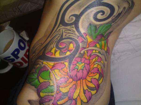 Old tribal new flower tattoo