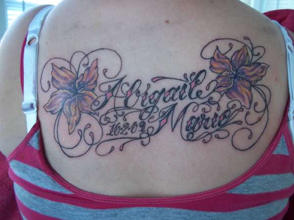 daughters name and flowers tattoo