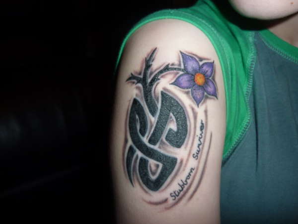 lymphoma flower rework on tribal tattoo