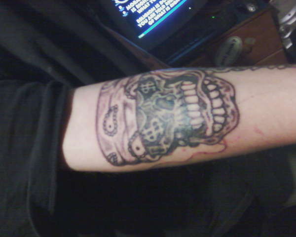 thuged out skull with revolver tattoo