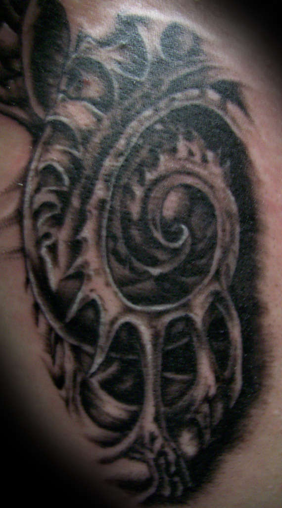 Bio mech chest tattoo
