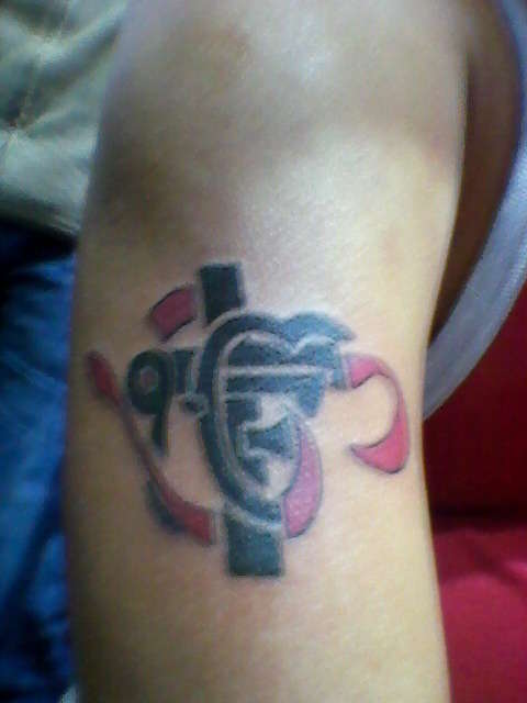 Om Ek Onkar Cross tattoo