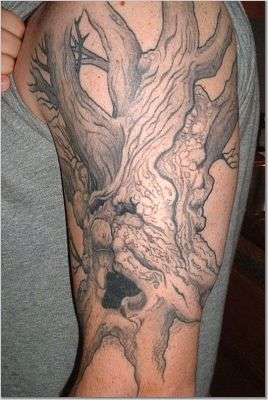 Face in Tree tattoo