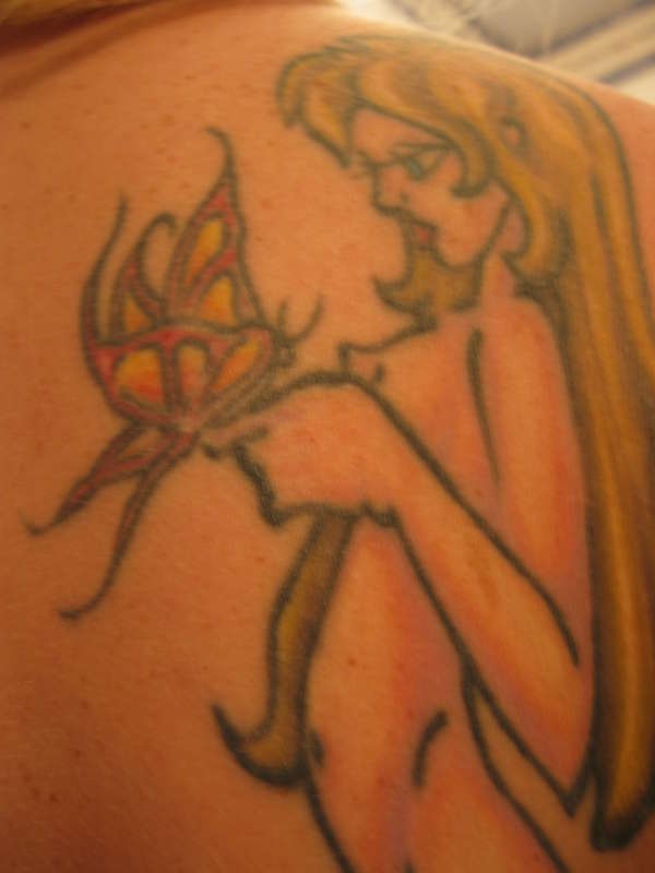girl holding butterfly tattoo