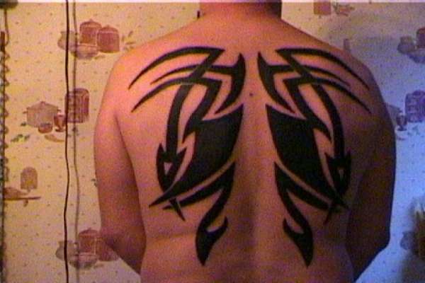Tribal back piece tattoo