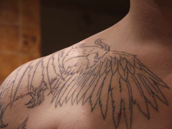 shoulder and chest area tattoo