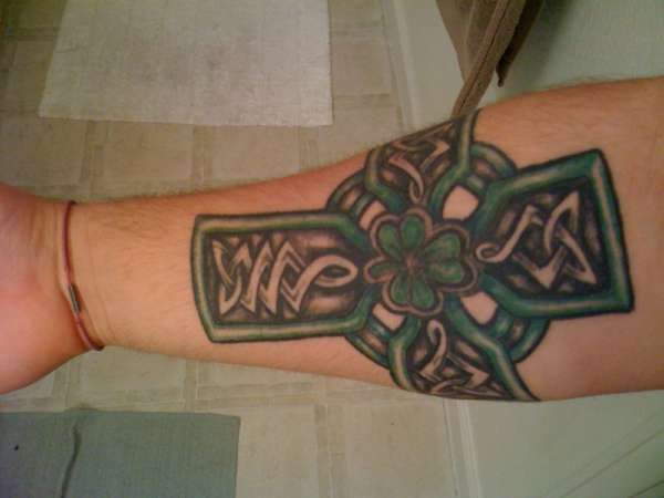 Forearm Coss tattoo