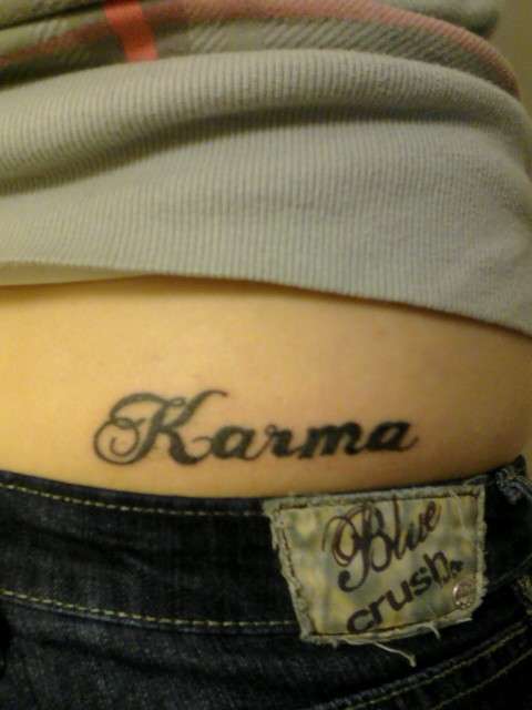 Karmas a Bitch tattoo