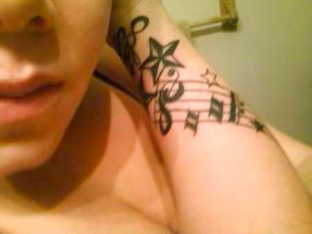 Music notes/stars tattoo