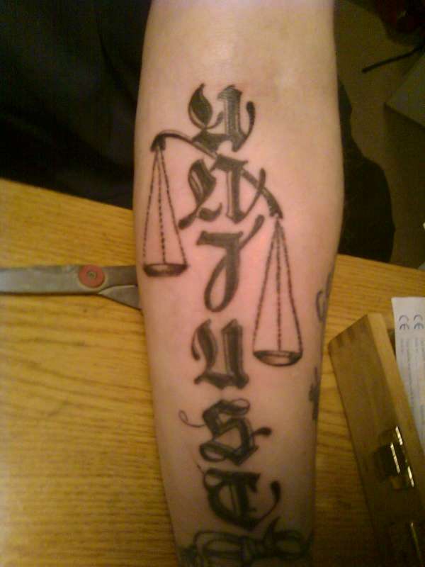 UNJUST tattoo