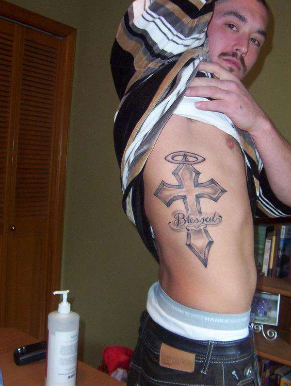 cross tattoo with halo and blessed