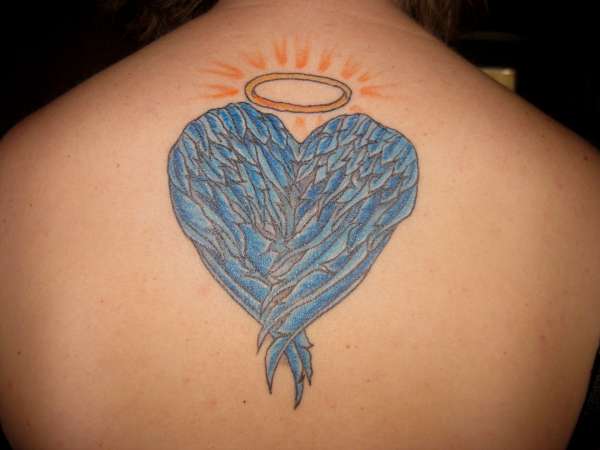 heart-shaped angel wings tattoo