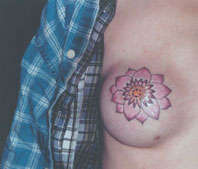 Flower boob tattoo