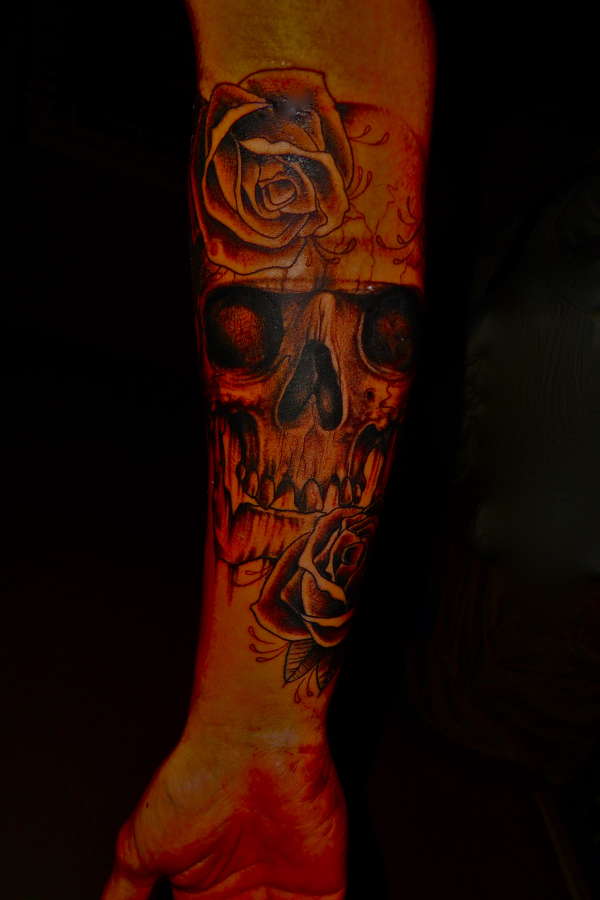 Skull with rose's tattoo