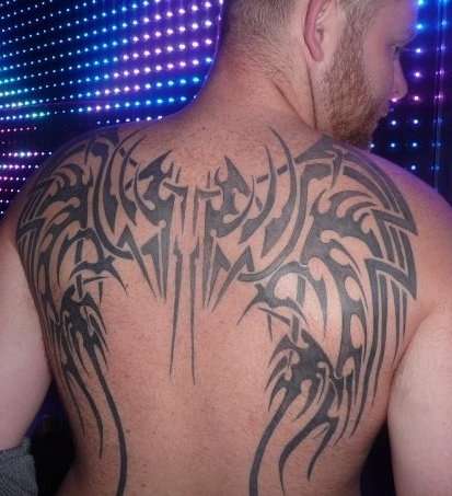 tribal wings tattoo on back
