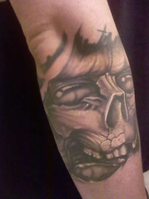 cracked skull tattoo