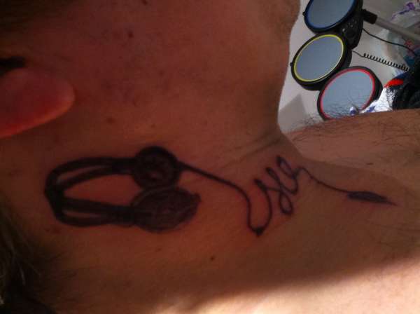 headphones on neck tattoo