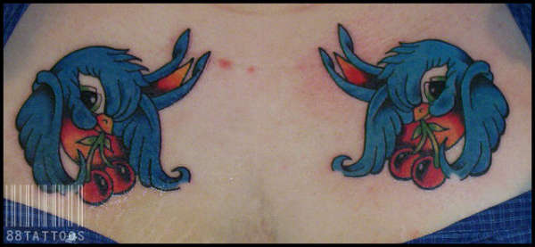 Swallows on Chest tattoo