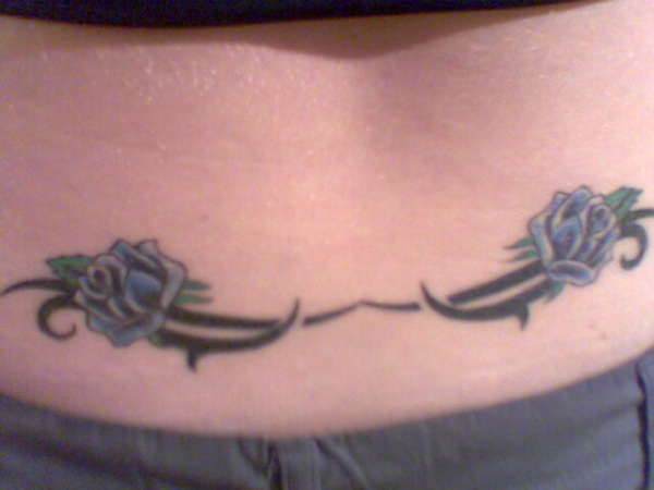 tribal with blue roses tattoo