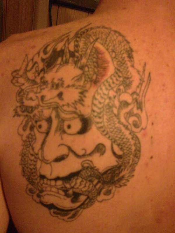 left back tattoo