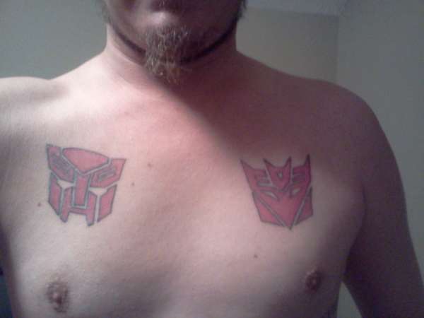 Autobots vs Decepticon tattoo