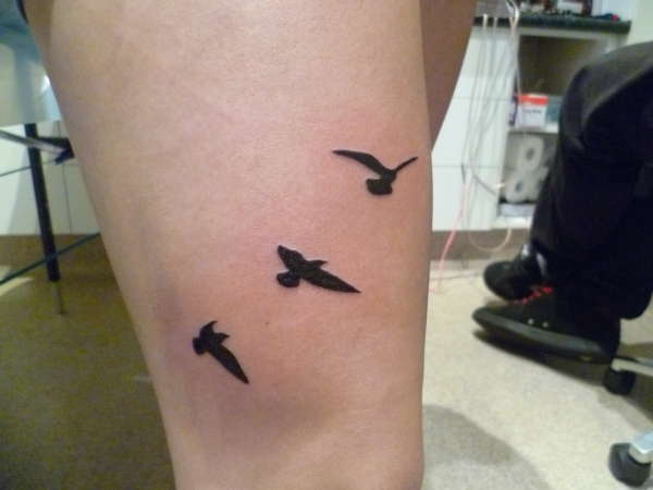 Birds on the thigh tattoo