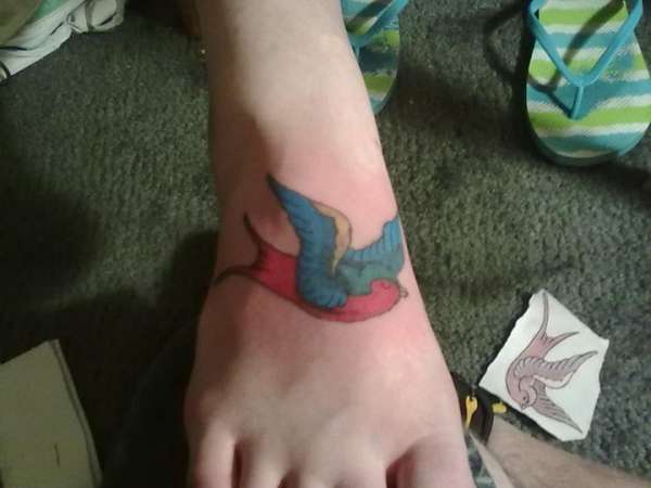 Sparrow on top of foot tattoo