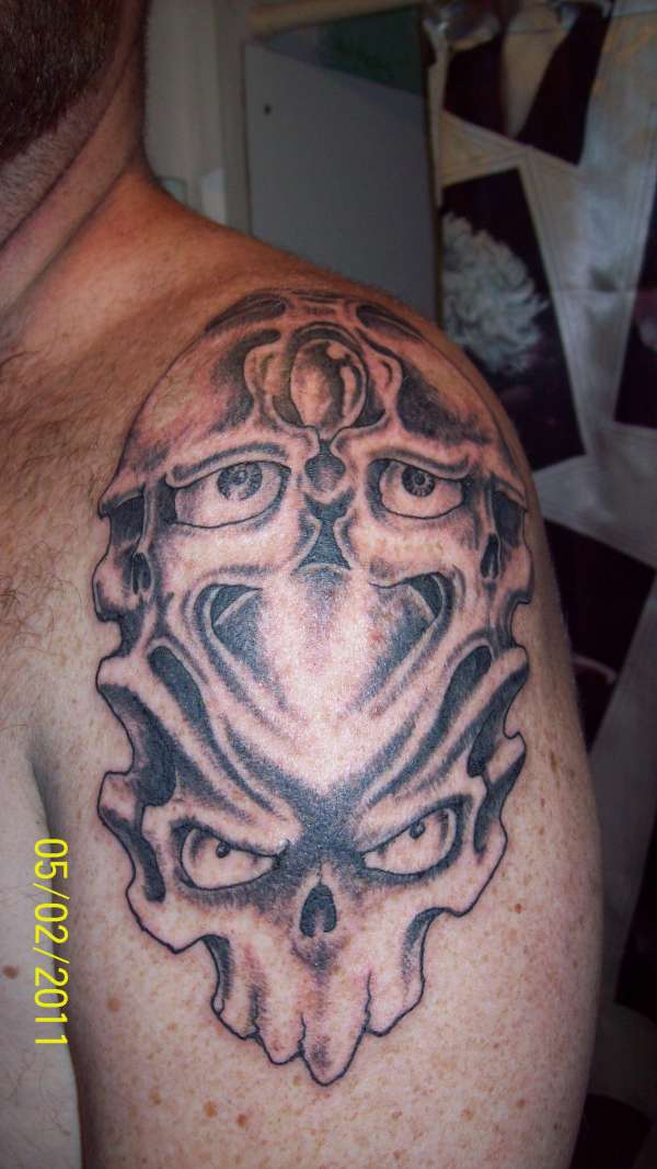 four skulls tattoo