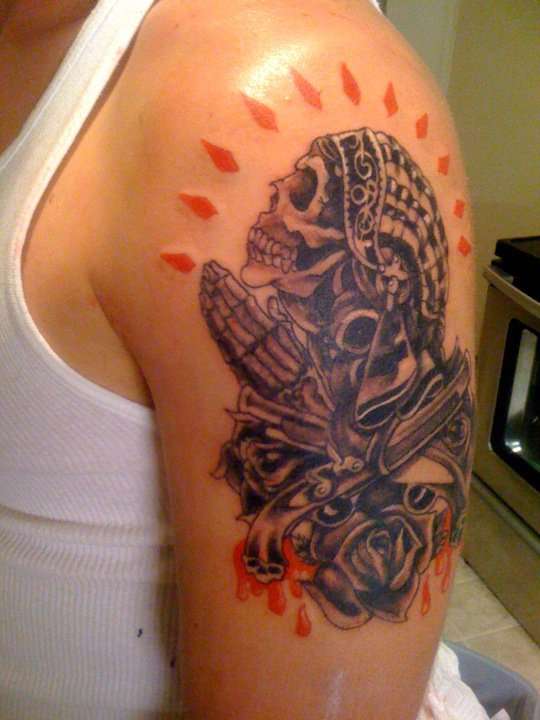 skull praying tattoo