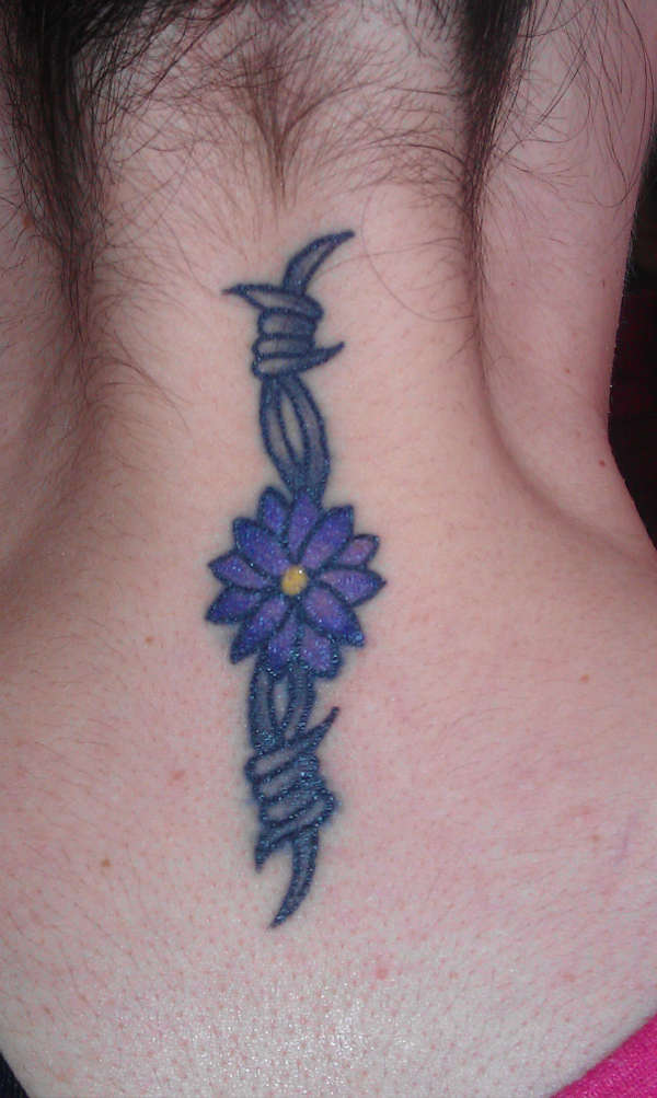 Daisy and barbed wire on neck tattoo